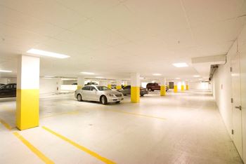 a parking garage with cars parked in it
